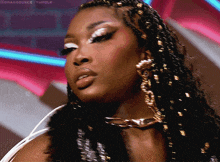 a close up of a woman 's face with the words dragsource tumblr at the top