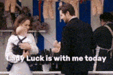 a woman is holding a baby and the words lady luck is with me today