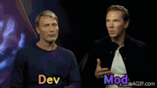 two men are sitting next to each other and the words dev and mod are on the screen