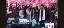 a group of people standing in front of a pink wall with the words " aise jaleb nahi kiya jata kisiko " on the bottom