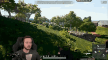 a man wearing headphones is playing a video game with the number 123 on the screen