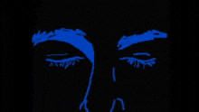 a drawing of a man 's face with blue eyes and a black background