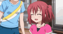 a girl with red hair is smiling next to a boy