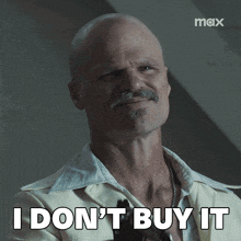 a man with a mustache says " i don 't buy it "