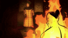 a man with a shaved head stands in front of a large fire
