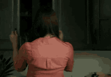Look Back Shrugs GIF - Look Back Shrugs Open The Cabinet GIFs