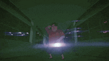 a person holding a flashlight in the dark