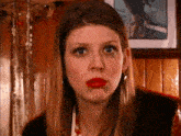 a close up of a woman with red lipstick on her lips
