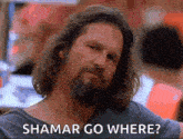 a man with long hair and a beard is asking where to go