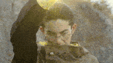 a man wearing glasses and a yellow shirt is holding a sword in his hand