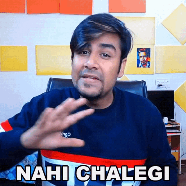 a man in a blue sweater says 