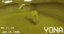 a person is laying on the floor in a room with the word yona on the bottom .