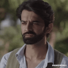 a close up of a man with a beard and the words barunsobtigifs on the bottom right
