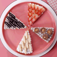 a pink plate with four different types of desserts