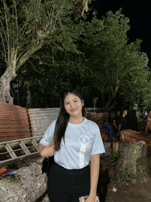 a woman wearing a t-shirt that says ' a ' on it