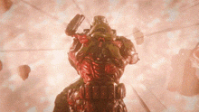 a man in a helmet is holding a gun in a room with balloons .