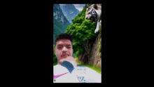 a man is taking a selfie with a white tiger .