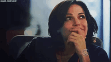 a woman with a cbs logo on her watch