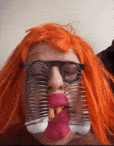 a woman wearing a wig and glasses has a spring in her mouth