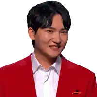 a man wearing a red jacket and a white shirt smiles