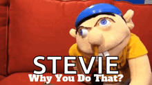 a steve puppet is sitting on a couch with a pencil in his mouth