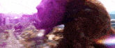 a blurry picture of a woman 's face with a purple background