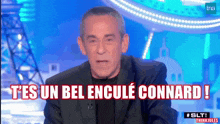 a man in a suit says t 'es un bel encule connard !