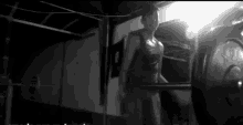 a black and white photo of a man lifting a barbell with the number 80 on it