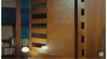a blurred image of a bedroom with the word jan written on the bottom