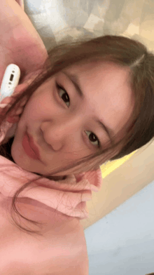 a close up of a woman 's face with a thermometer in her hand that says ' thermometer ' on it