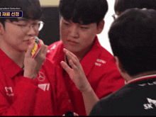 a man in a red shirt with a mercedes logo on it