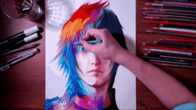 a person is drawing a person with colorful hair with a pencil