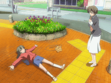 a girl is laying on the ground with her arms outstretched