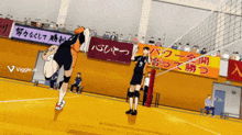 a volleyball player with the number 9 on his jersey jumps in the air