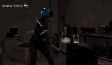 a person wearing a helmet is in a dark room with the words general hospital abc written on the bottom