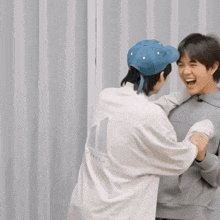 a man wearing a white shirt with the number 11 on it is giving another man a high five