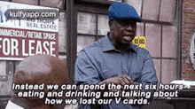 a man in a blue hat is talking to another man in front of a building with a for lease sign .