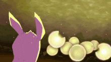 a purple rabbit with yellow ears looks at a bunch of yellow balls