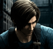 a man with long hair and a beard is wearing a blue shirt and carrying a backpack .