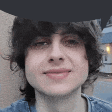 a close up of a person 's face with a hat on their head