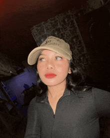 a woman wearing a hat that says ' i 'm a ' on it