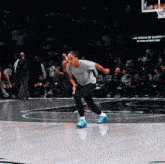 a basketball player wearing a shirt that says the house of santos