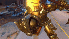 a video game character is holding a sword and shield and has a flame coming out of his chest