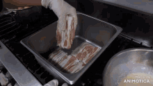a person is putting bacon in a pan that is made in animatica