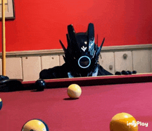 a pool table with a robot on it and the words imgplay below it