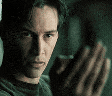 a close up of a man 's face and hands