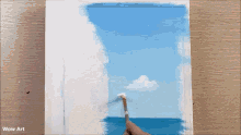 a person is painting a picture of the ocean with a brush and the words wow art on the bottom