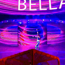 a woman is standing in front of a sign that says bell .