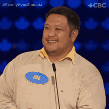 a man wearing a name tag that says joe on it