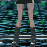 a woman 's legs are shown in front of a grid of green dots